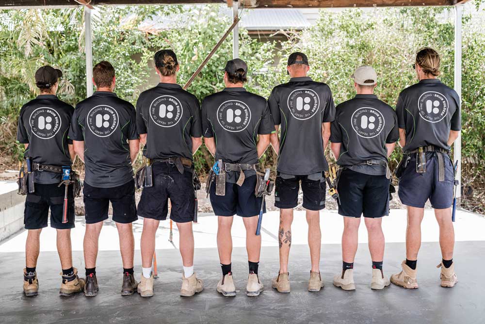 Photo of seven Bruin Builders facing backwards