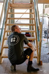 Bruin Builders team working on a wooden staircase.