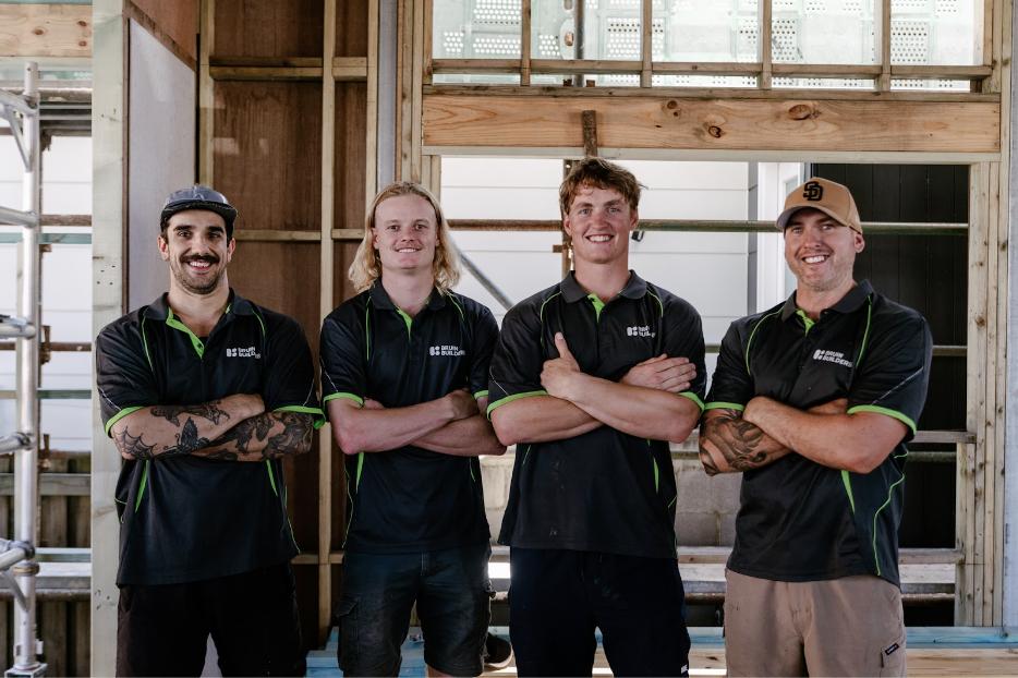 The Bruin Builders team on a construction site.