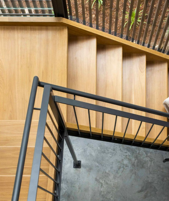 Beautiful wooden staircase with matt black metalwork